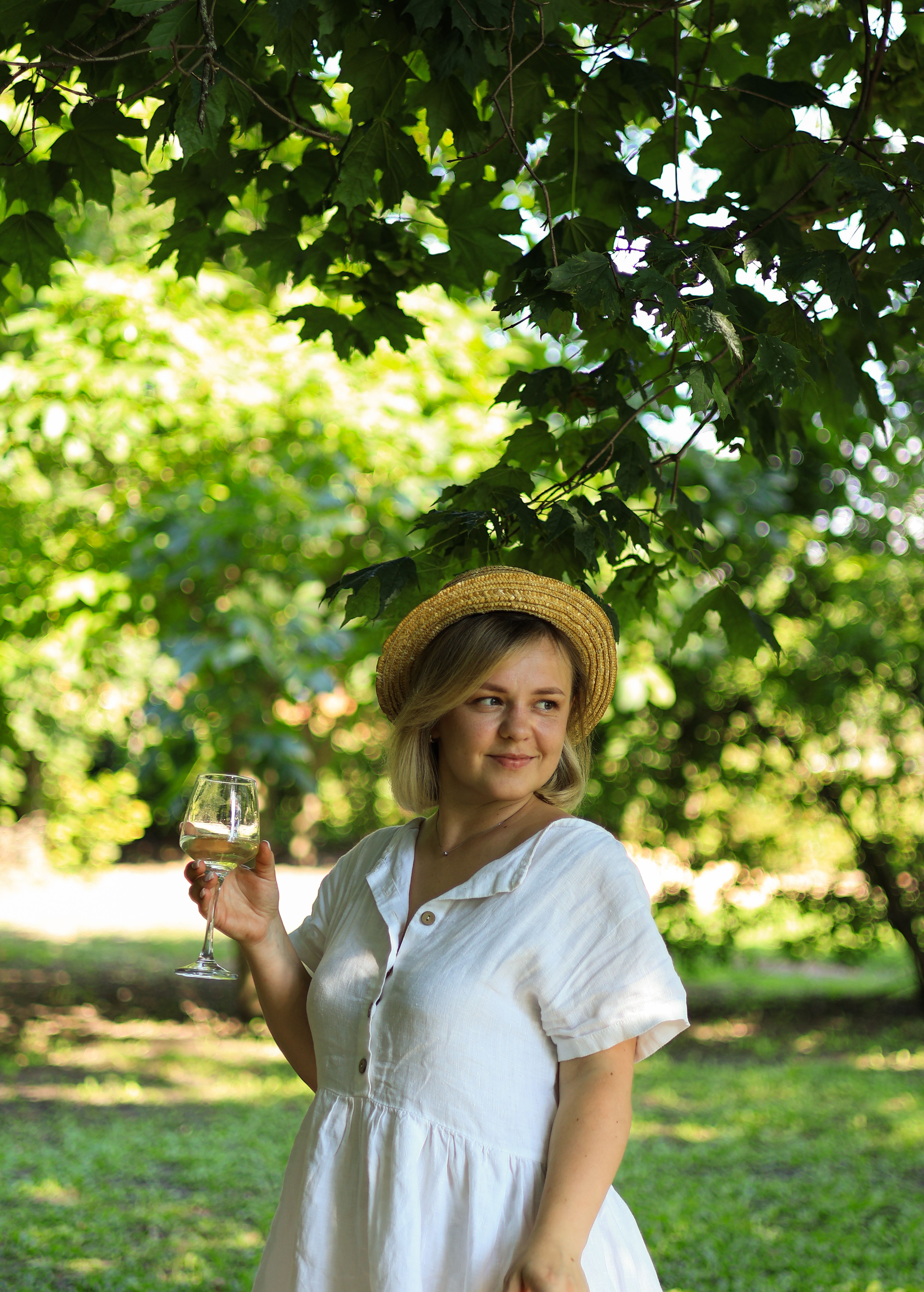 Woman in Holding a Glass of White Wine · Free Stock Photo