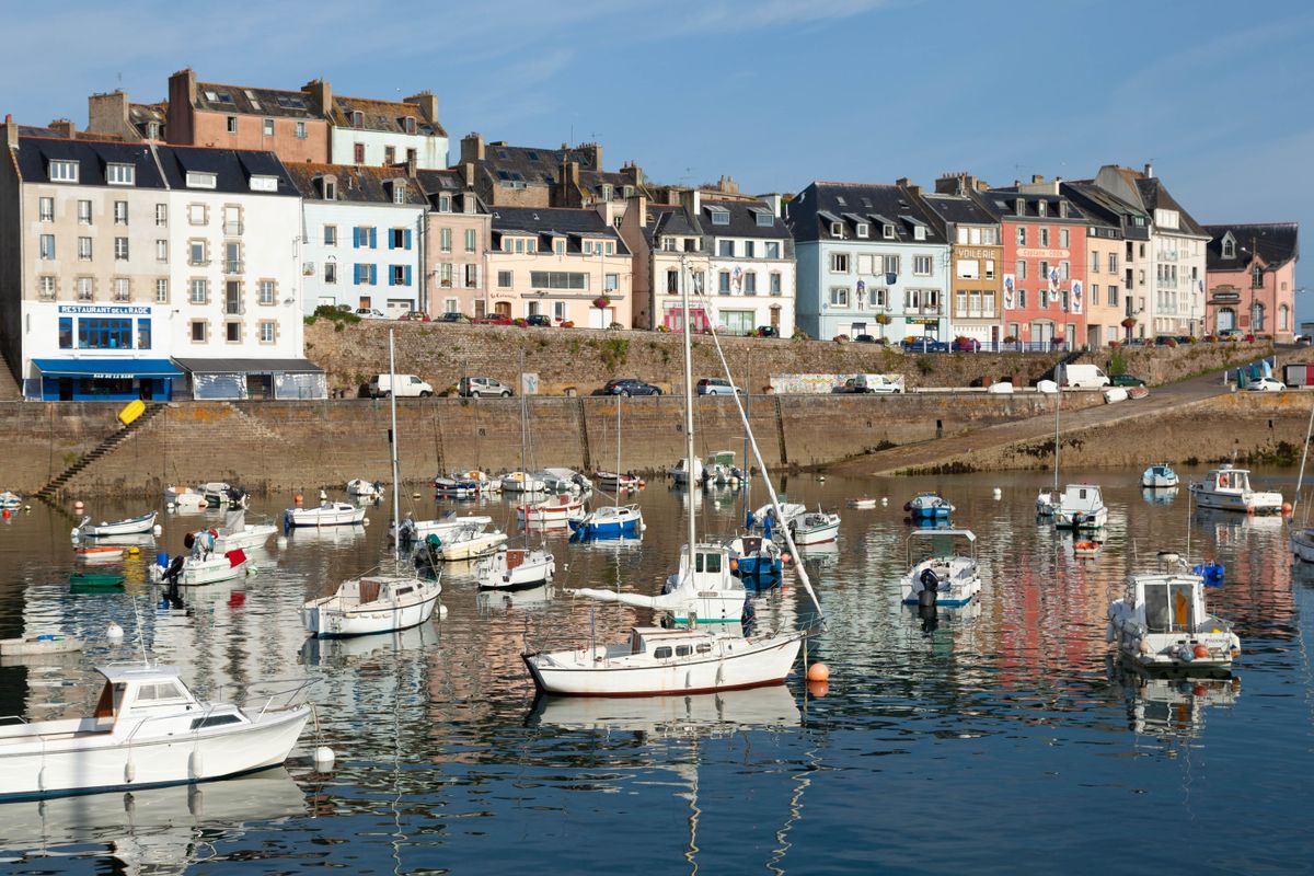 Colorful houses and moored boats in Douarnenez harbour
