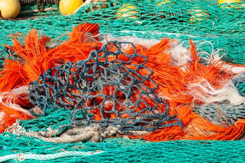 Free Vibrant fishing nets tangled together in Guilvinec, France, showcasing marine industry. Stock Photo