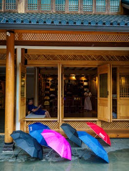 Vibrant umbrellas outside a traditional shop in Mae Hong Son, Thailand.