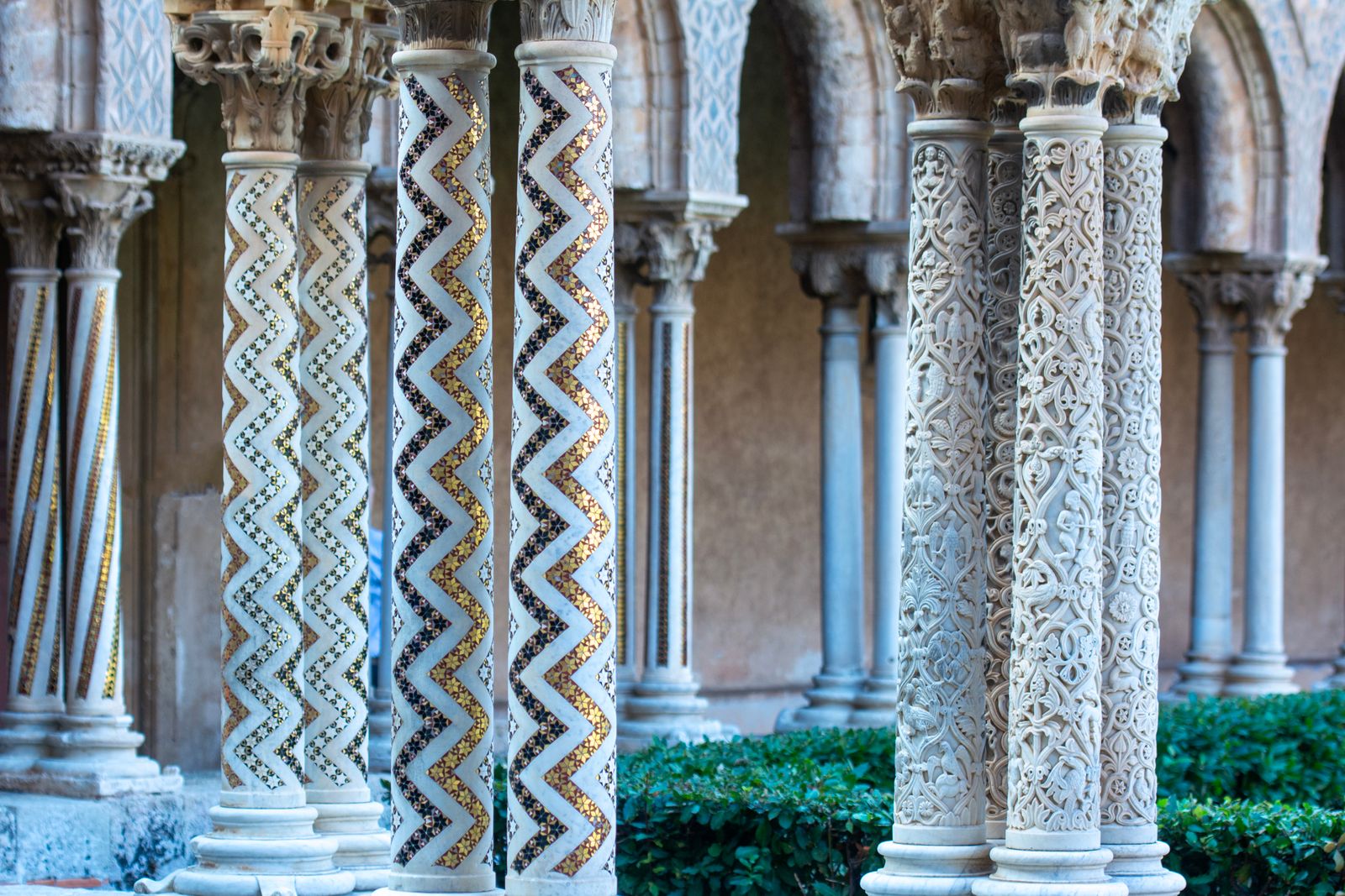 The cloister at Monreale, its columns inlaid with gold zigzag mosaic
