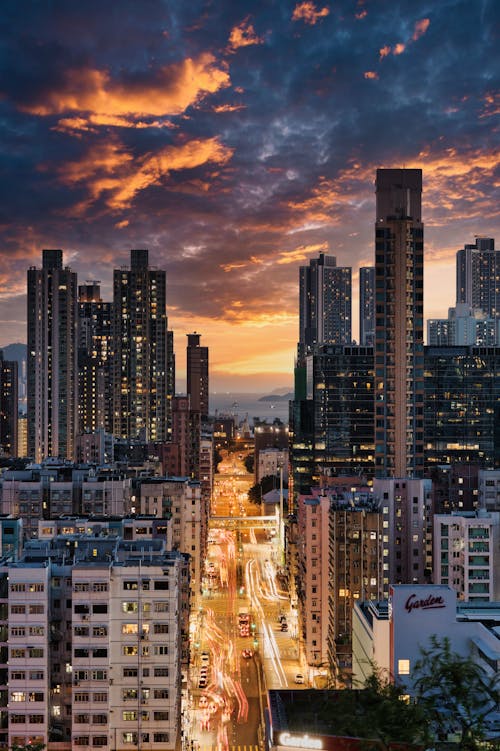 Free Aerial View of a Modern City at Sunset  Stock Photo