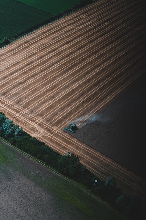 Drone Shot of Combine Harvester in Field