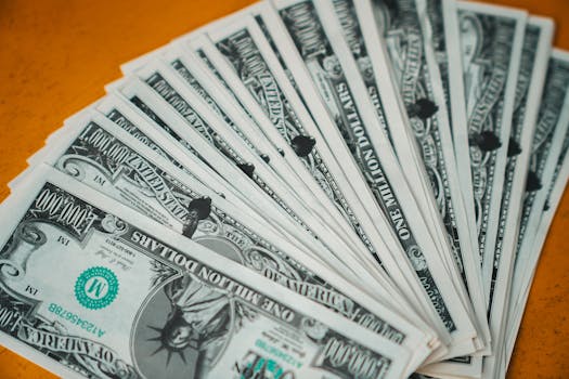 Closeup of novelty one million dollar bills laid out in a fan arrangement.