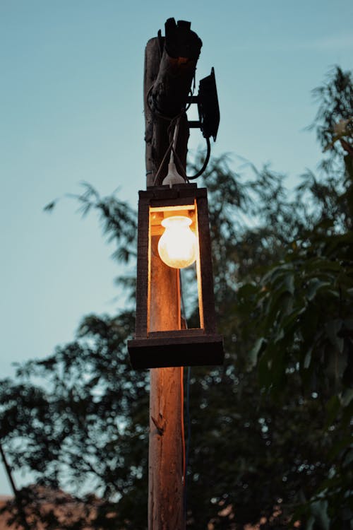 Light Bulb under Wooden Post