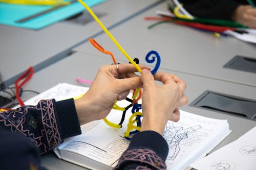 Woman Hands Holding Colorful Strings