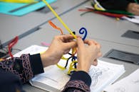 Woman Hands Holding Colorful Strings
