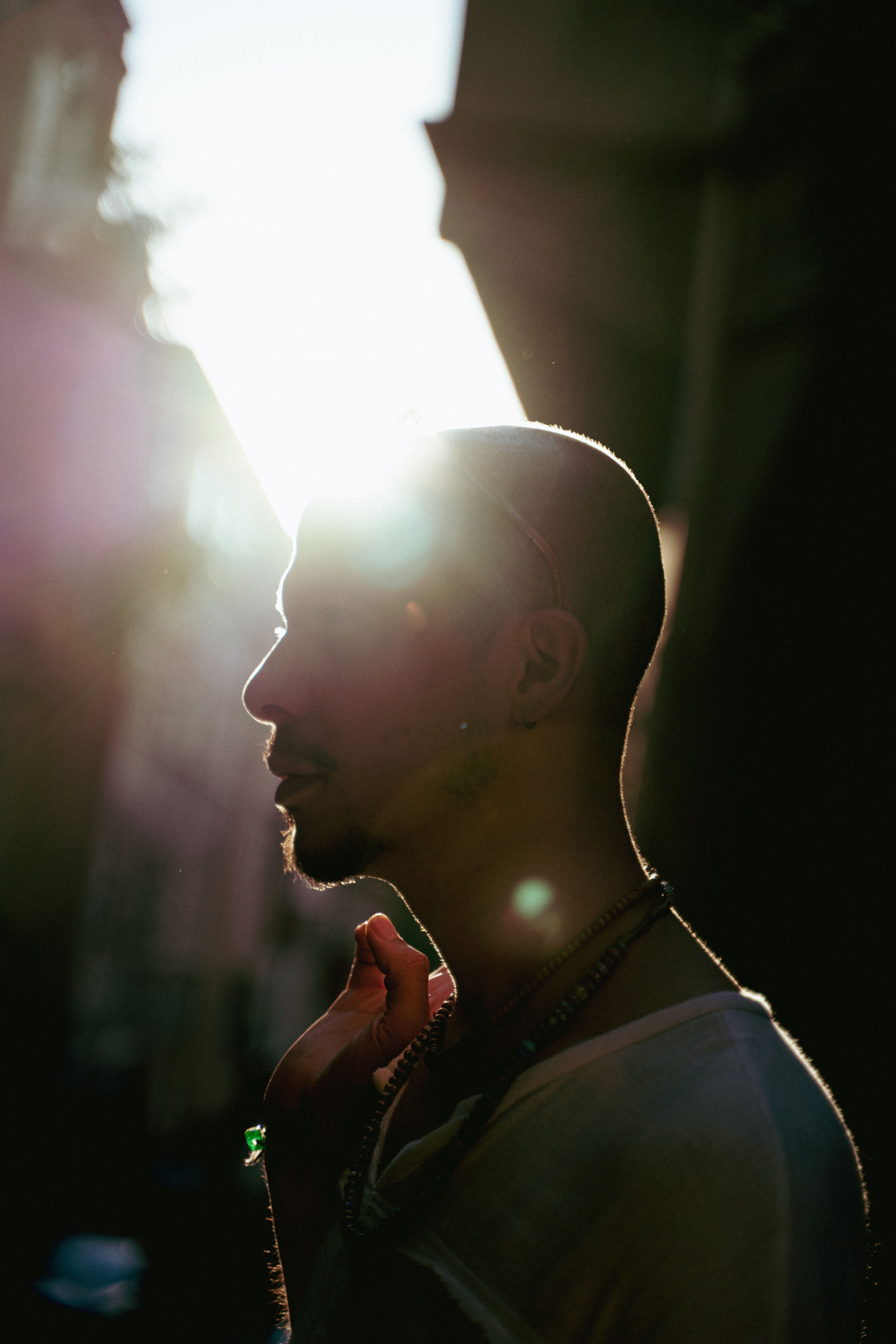 Artistic silhouette of a man with sun flare in urban İstanbul street scene.