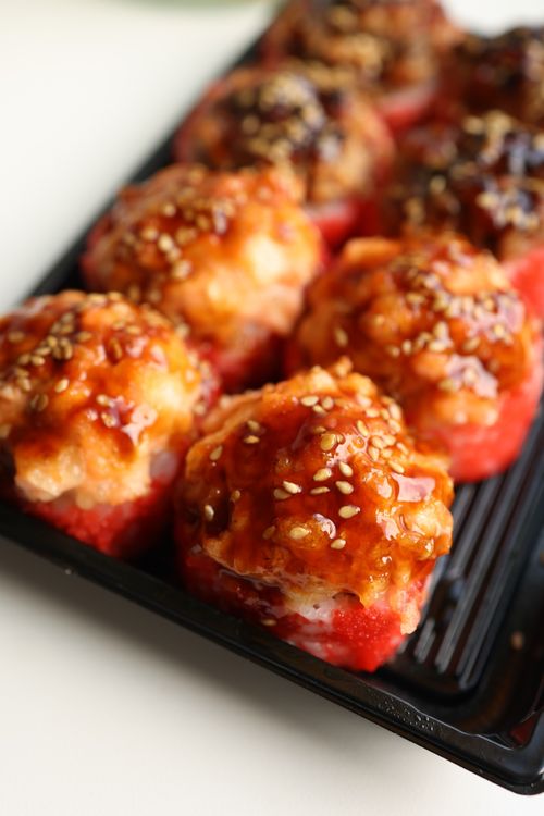 Free Mouth-watering glazed stuffed tomatoes served on a tray, perfect for gourmet dining. Stock Photo