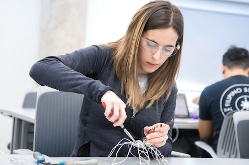 Woman Making a Wire Structure