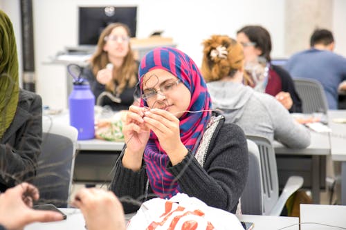 A Woman Sitting in an Art Class