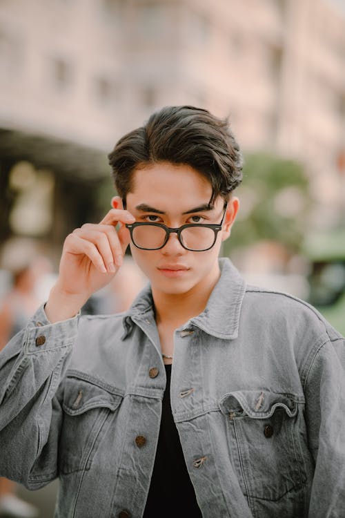 Portrait of Man Wearing Glasses and Jean Jacket