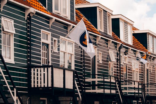 Traditional row houses with Dutch flags in Marken, Netherlands.