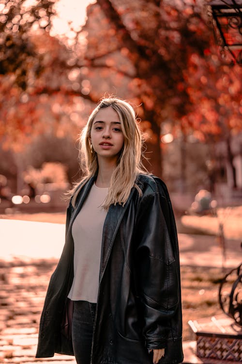 Blonde Woman in Park in Autumn