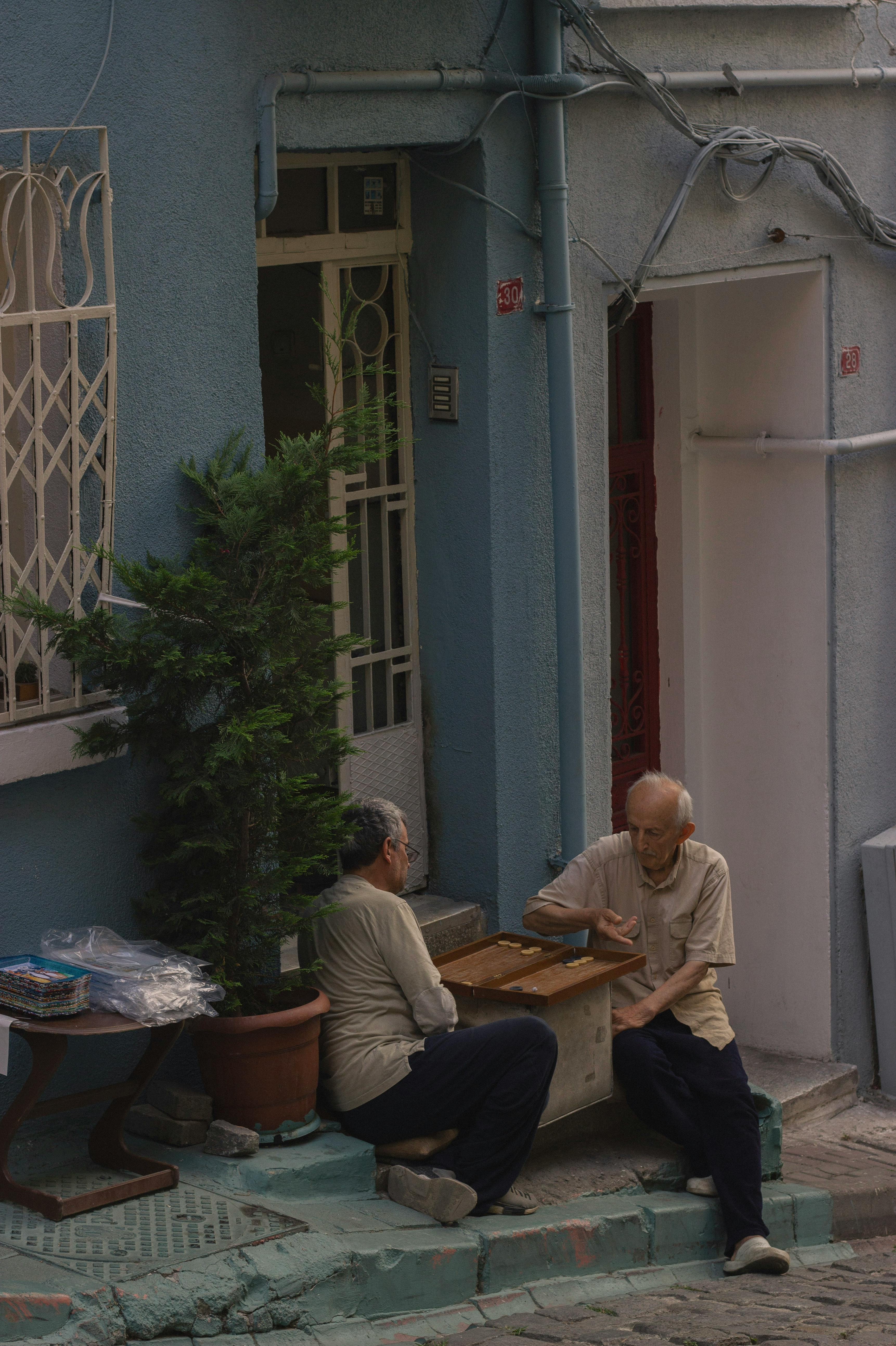 Elderly Men are Playing Game by House · Free Stock Photo