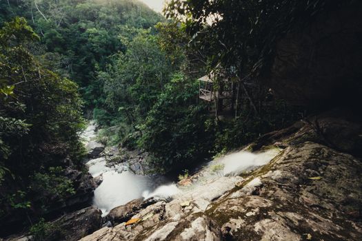 Stunning view of a waterfall cascading through lush Peruvian forest in Jepelacio, San Martín.