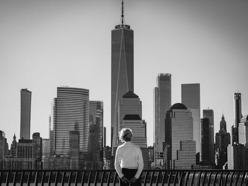 Woman in Shirt Standing with Manhattan Buildings behind