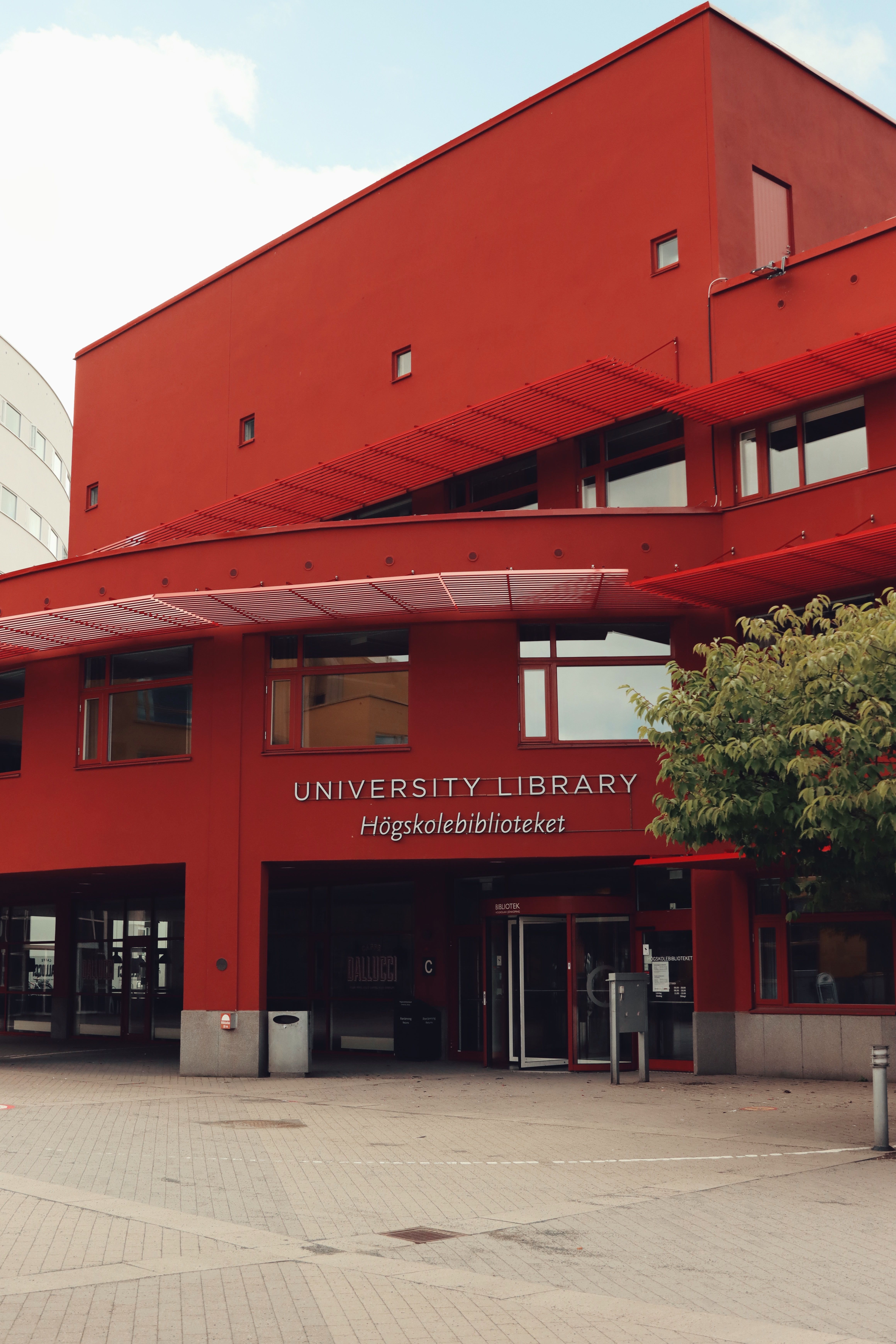 Vibrant red facade of the University Library in Jönköping, Sweden.