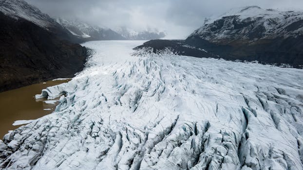 Majestic aerial shot of the Vatnajökull Glacier in Iceland with snow-covered peaks.