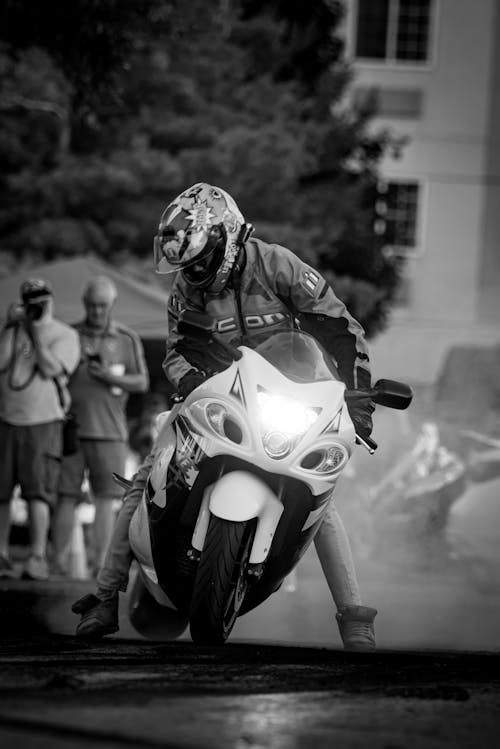 Black and White Picture of a Man on a Motorcycle 