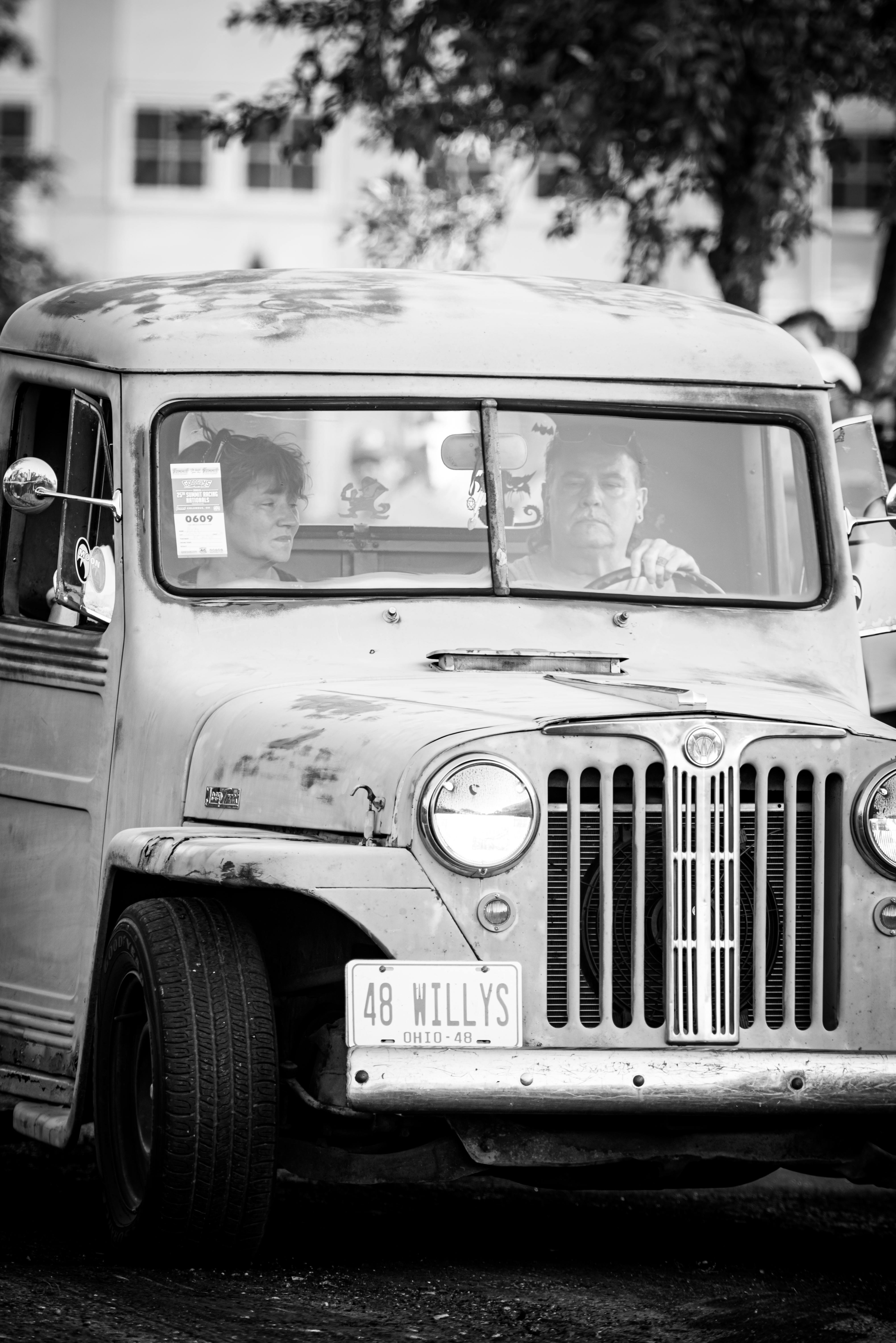 Two People Sitting in an Off-Road Car · Free Stock Photo