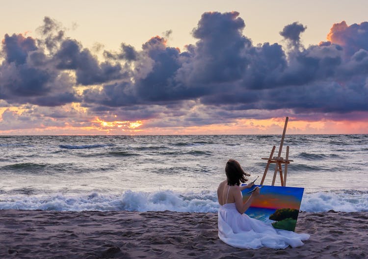 Woman Painting On A Beach 