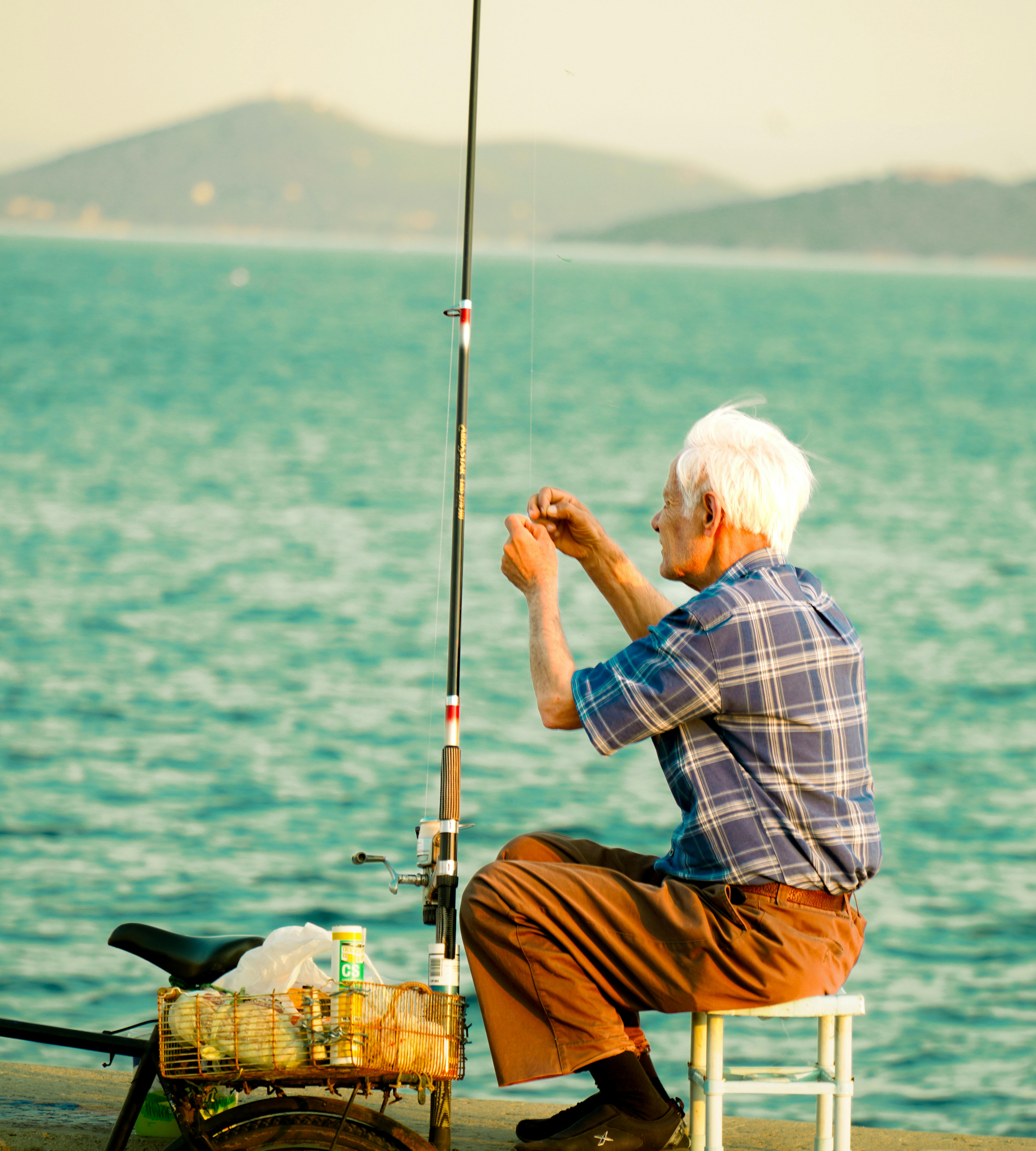 Fisherman Sitting in a Chair · Free Stock Photo