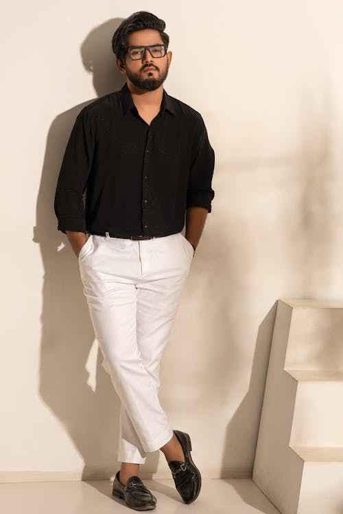 Man in Black Loafers, White Pants and Black Shirt