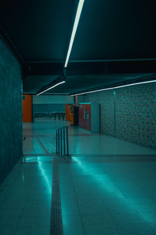 Free Empty, modern subway station hallway with teal lighting in Bursa, Turkey. Stock Photo