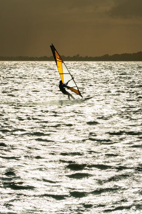 Foto stok gratis Fajar, foil sayap, laut