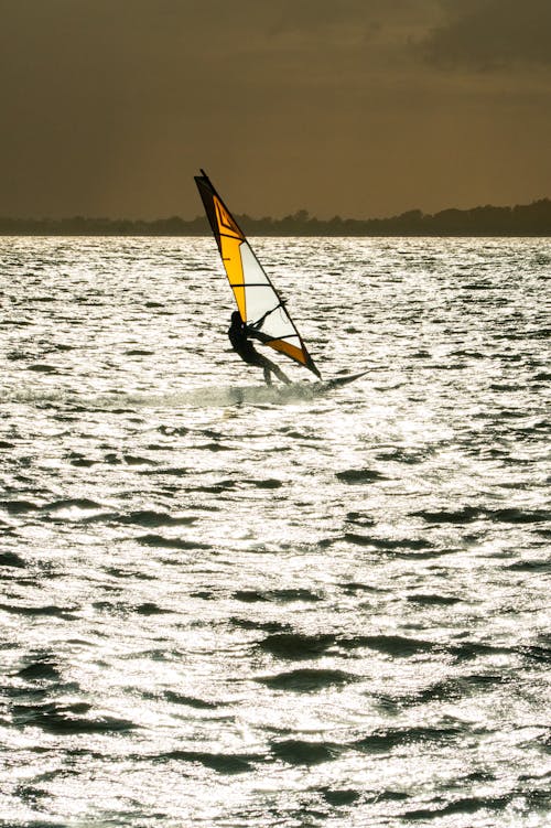 Person Wing Foiling on Sea