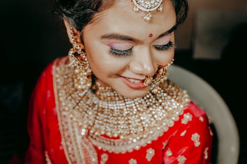 Happy Bride with Traditional Jewellery in Red Dress