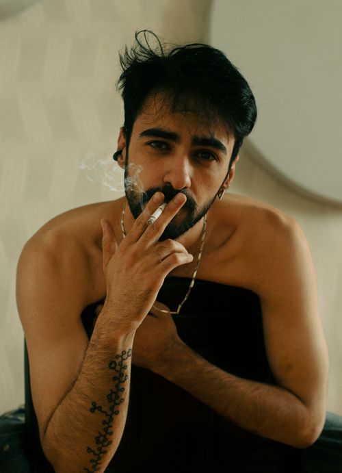Free Indoor portrait of a man smoking, with a relaxed expression, captured in Baku, Azerbaijan. Stock Photo