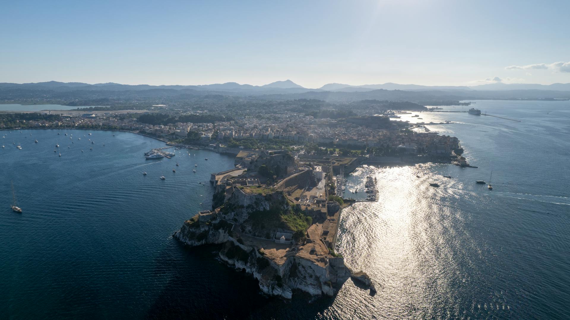 Stunning aerial view of Corfu's coastline showcasing the island's natural beauty and the Ionian Sea.