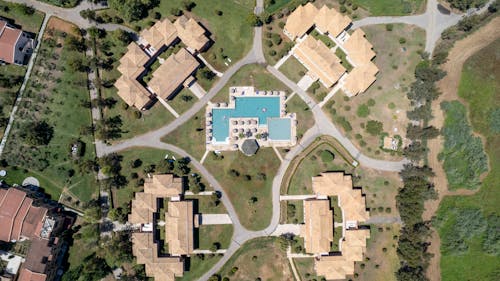 Sunlit Roofs of Buildings in Park