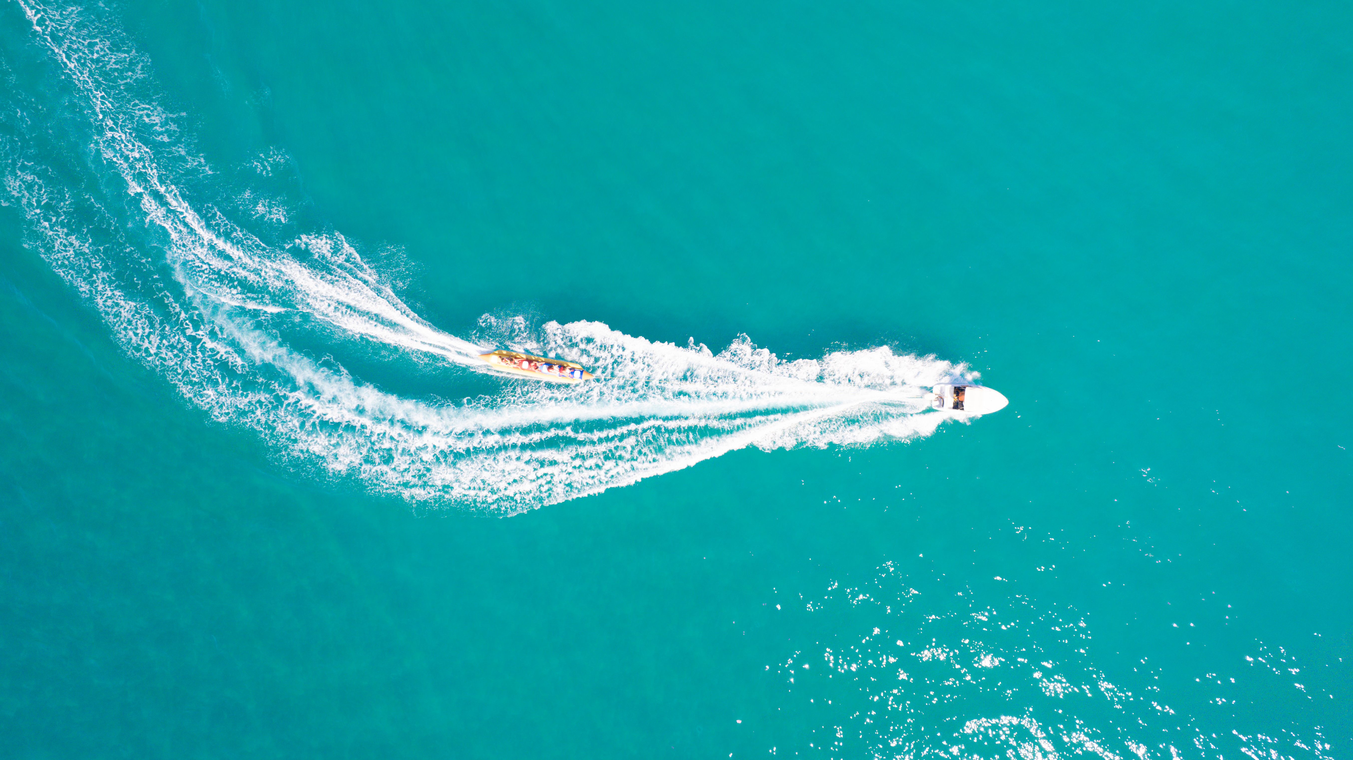 Aerial View of a Person Riding a Motorboat on the Sea · Free Stock Photo