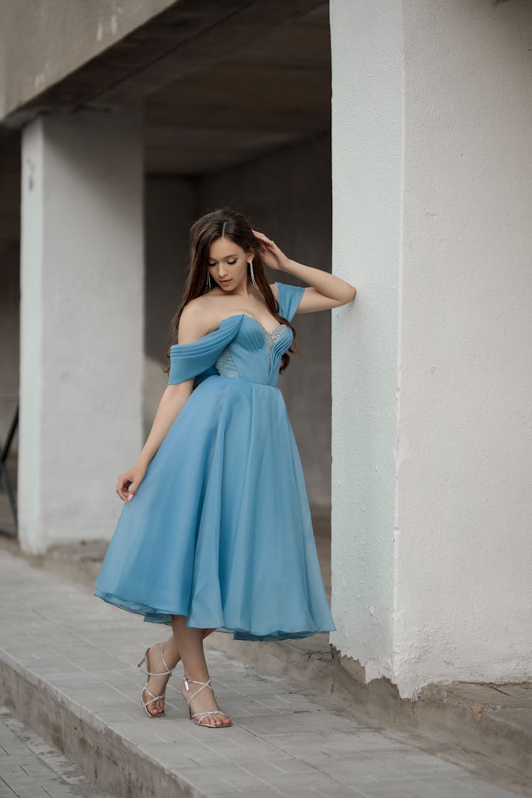 Woman Posing In Blue Dress