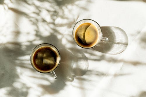 Top View of Tow Black Coffees in Glasses on the Table 