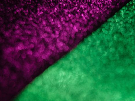 Close-up abstract bokeh photography with vibrant purple and green hues. Ideal for creative backgrounds.