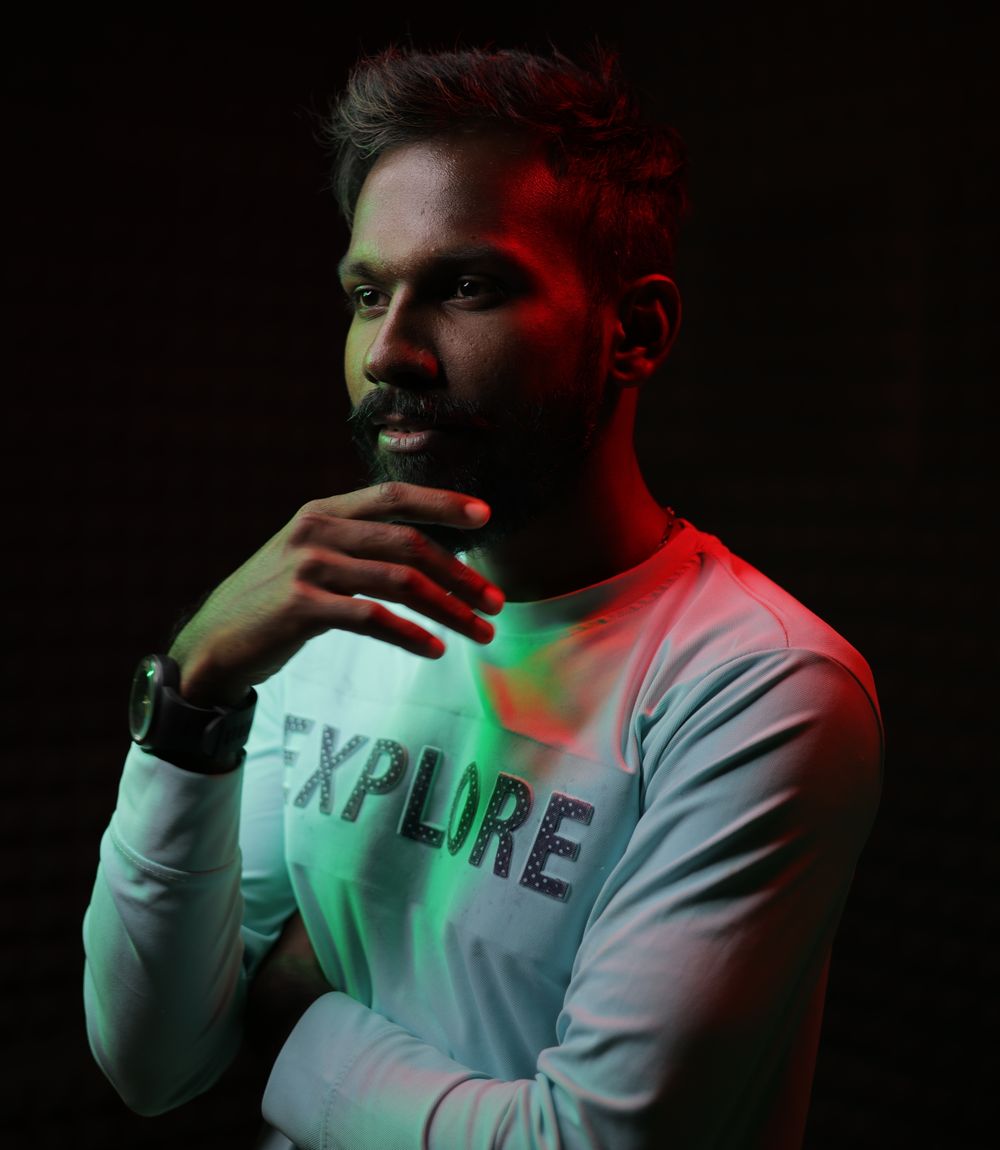 Man modeling a long sleeve T-shirt in a studio