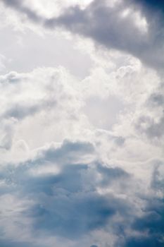 A serene view of fluffy white clouds against a bright sky in Talgar, Almaty Region, Kazakhstan.