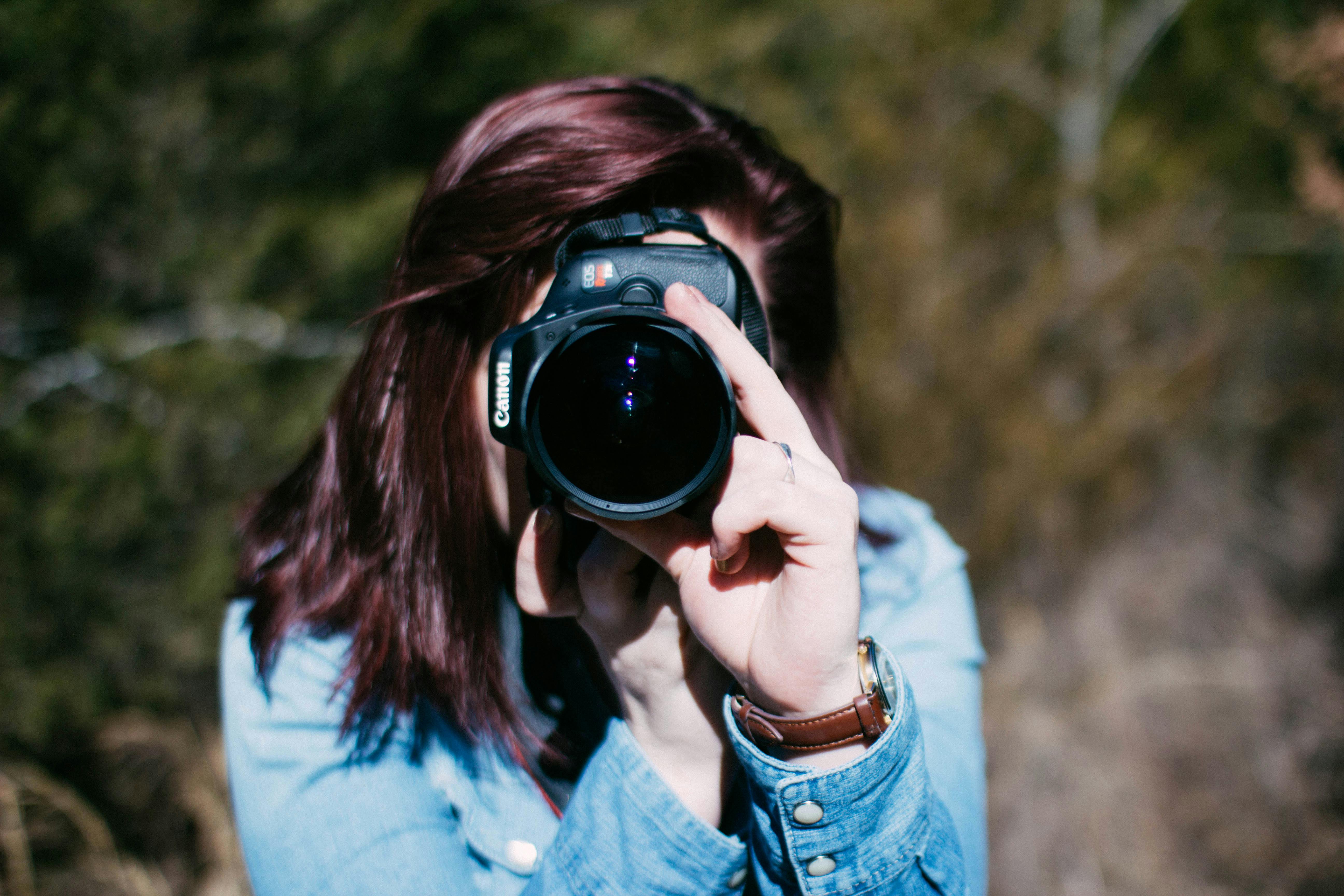 Woman Holding Canon Dslr Camera · Free Stock Photo