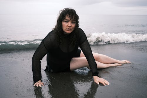 Brunette in Black Outfit at Beach