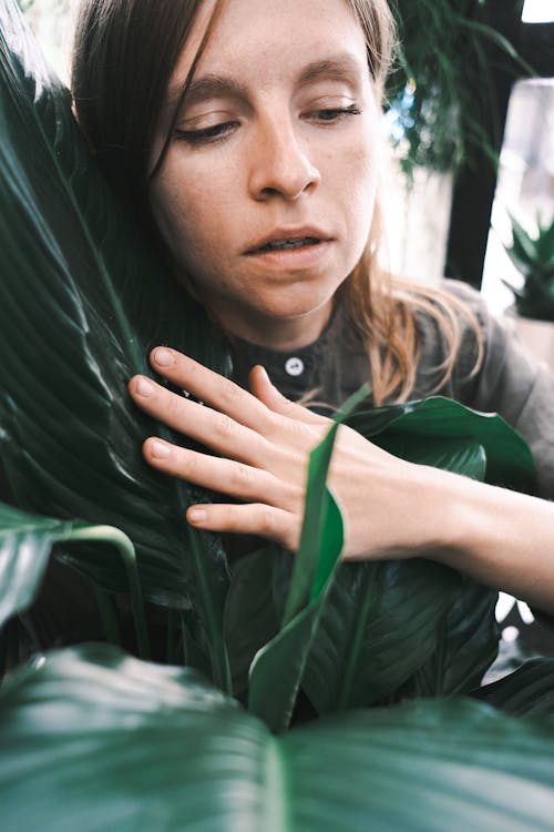 Woman Touching Leaves