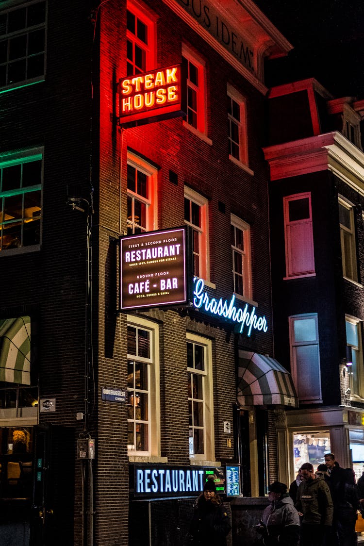 Neon Light Sign On The Side Of A Building