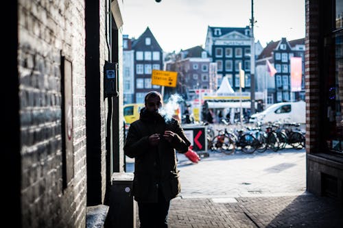 Man Walking Through an Alley