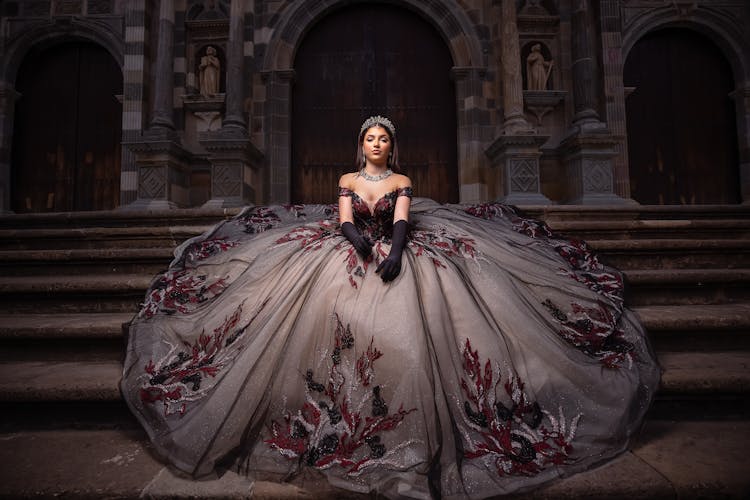 Woman Wearing Goth Dress In Front Of An Antique Building