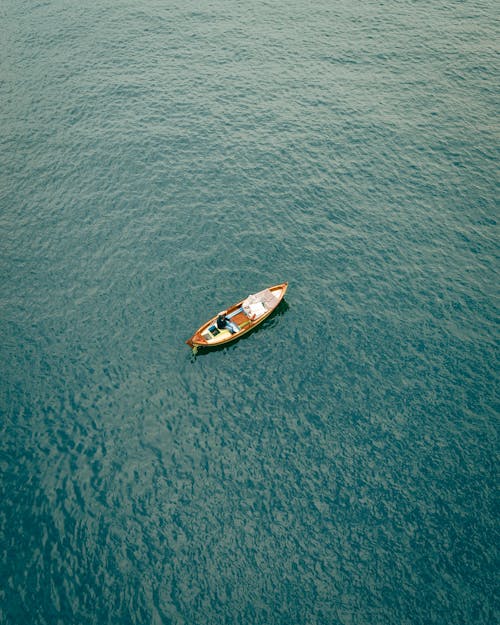 Free Drone Shot of Boat in Sea Stock Photo