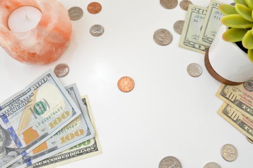 Gold and Silver Coins on the Table