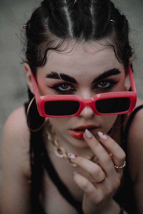 Young Woman Wearing Pink Thick Rimmed Sunglasses